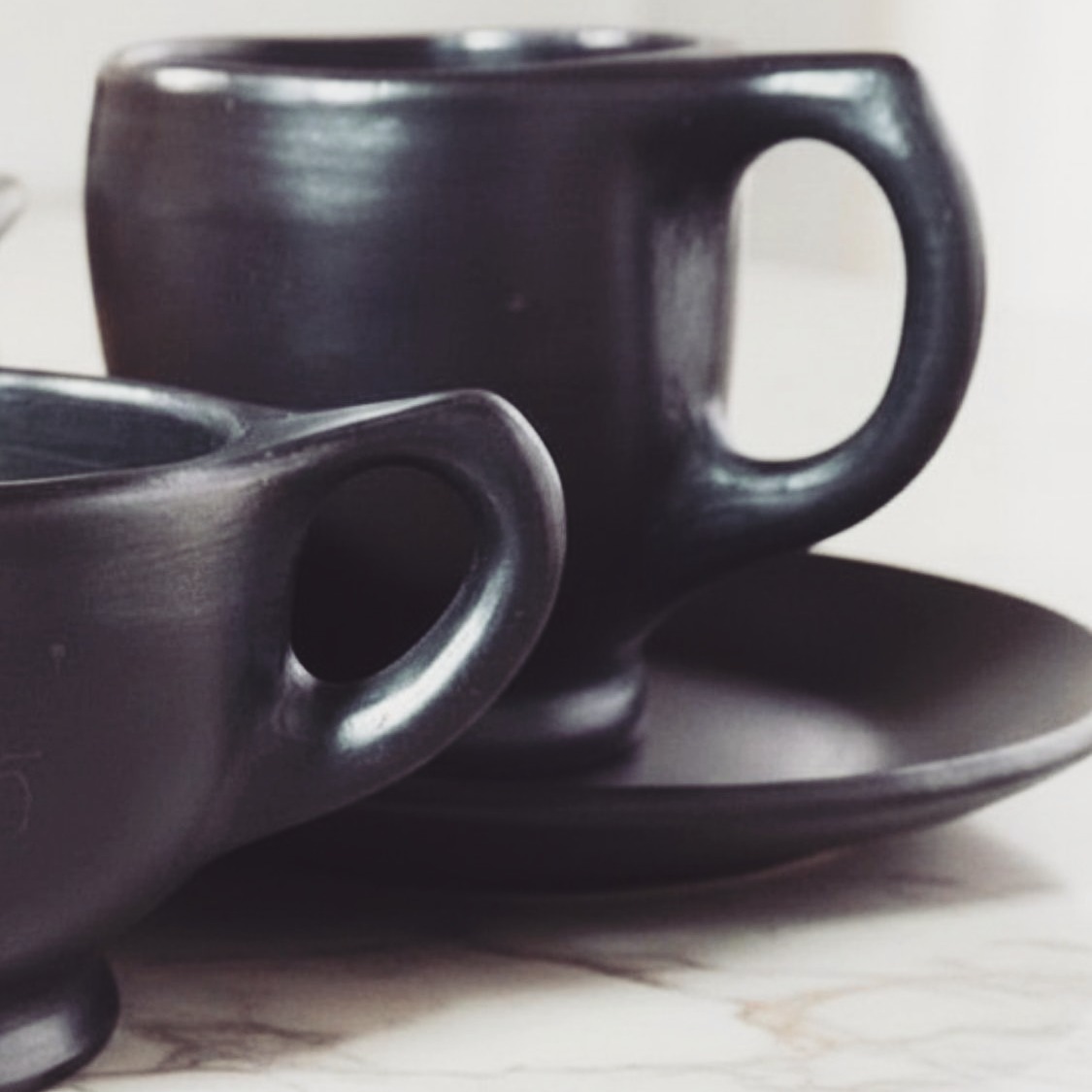 Something beautiful is brewing. ☕🖤

We’re giving you a sneak peek at the newest additions to the collection: our upcoming coffee cups and mugs.

Each piece is individually handcrafted, blending the raw, smoky texture of traditional black clay with a sleek, modern silhouette. They are currently finishing their journey through the kiln and will be ready to elevate your daily coffee ritual very soon.

Beautiful rituals take time, but we promise these are worth the wait. ✨

#AlunaMari #ComingSoon #BlackPottery #HandcraftedCeramics #CoffeeLovers #MugLife #ArtisanalDesign #SlowLiving